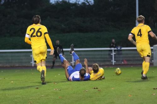 Jared Small (white) is brought down by Ramsgate's Tom Chapman for the penalty that gave Enfield their eighth goal