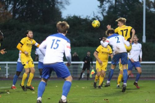 Josh Urquhart (2) scores Enfield's sixth goal