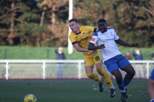 Ramsgate's Luke Carey (L) and Enfield's Percy Kiangebeni