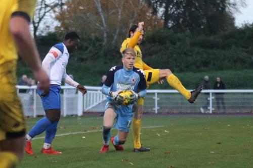 Ramsgate keeper Jacob Russell and Ryan Johnson (R) and Enfield's Neville Nzembela