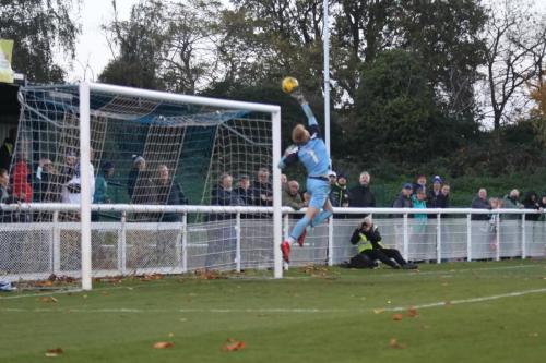 Ramsgate keeper Jacob Russell backpedals to tip a long-range effort to safety