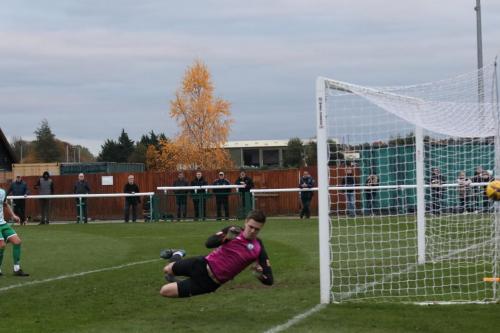 IMG 7489-Biggleswade-keeper-Jake-Alley-tips-a-shot-past-the-post