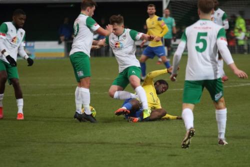 IMG 8804-Enfields-Andre-Coker-comes-off-worst-in-a-challenge-with-Calvin-Davies-who-steps-on-his-leg