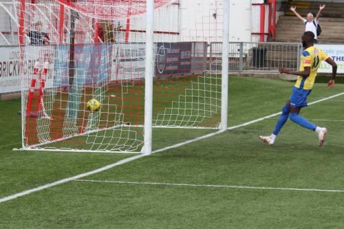 Muhammadu Faal follows up as a header from Carshalton defender Bobby Price past his own keeper gives Enfield- a first-minute lead