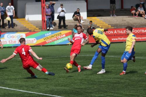 Enfield's Muhammadu Faal shoots as Luke Read 4 tries to block
