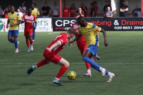 Carshalton's Luke-Read (L) and Enfield's Muhammadu Faal