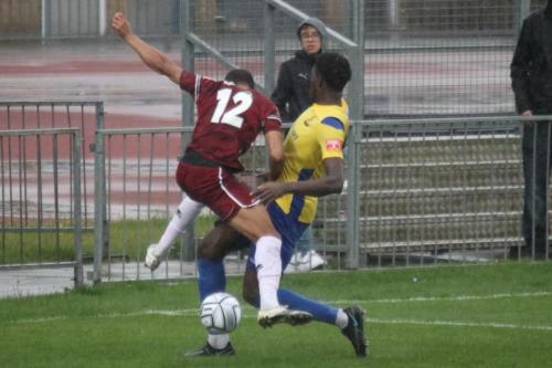 IMG 5114-Enfields-Jerry-Gyebi-R-blocks-the-run-of-Simeon-Jackson