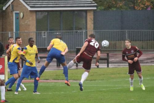 IMG 5138-Enfields-Adam-Cunnington-centre-half-clears-a-corner-but-the-ball-is-returned-into-the-box-for-Chelmsfords-winning-goal