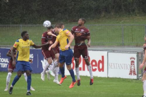 IMG 5178-Enfieds-Adam-Cunnington-yellow-R-challenges-at-a-set-piece