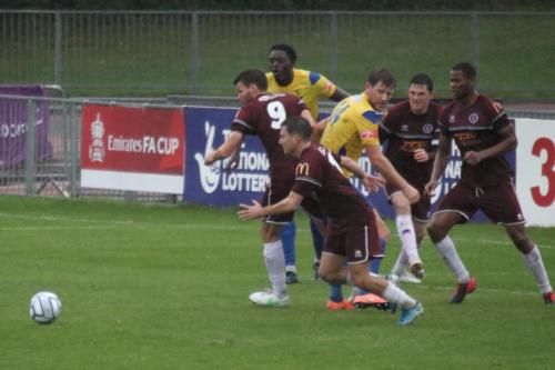 IMG 5190-Chelmsfords-Callum-Harrison-claret-foreground-chases-a-clearance