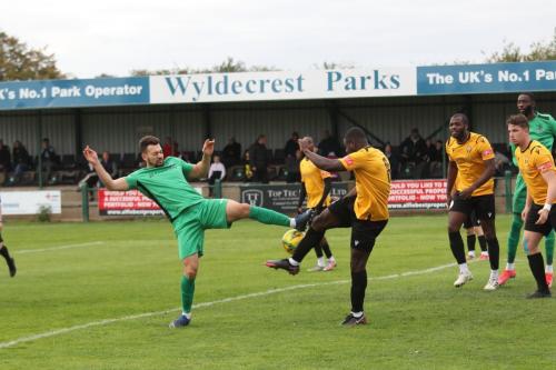 IMG 6370-Enfields-Lyle-Della-Verde-green-and-East-Thurrocks-Sam-Owusu-stretch-for-a-loose-ball-which-falls-for-Adam-cunnington-to-open-the-scoring
