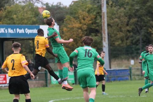 IMG 6614-Enfields-Adam-Cunnington-flicks-a-header-over-Sam-Owusu-8