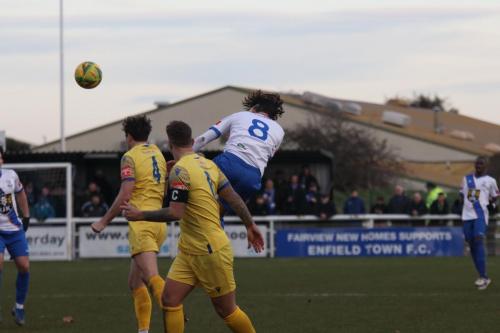 IMG 2544-Enfields-Sam-Youngs-wins-a-header