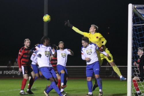 IMG 7105-Bedfont-keeper-George-Gay-punches-clear-under-pressure-from-Lewis-Taaffe