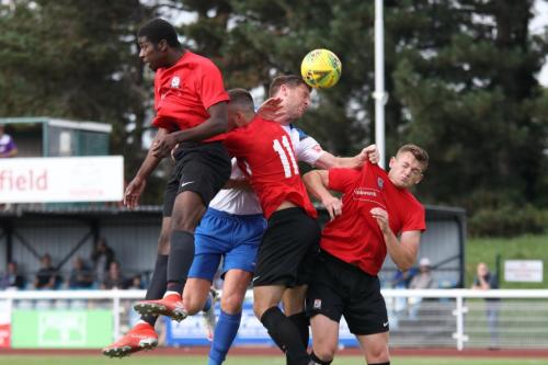 IMG 4590-Enfields-Adam-Cunnington-wins-a-header-despite-the-efforts-of-Jordan-Edwards-L-Luke-Alfano-and-Billy-Baird