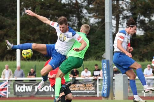 IMG 4594-Enfields-Adam-Cunnington-collides-with-Hadley-keeper-Luke-Ward