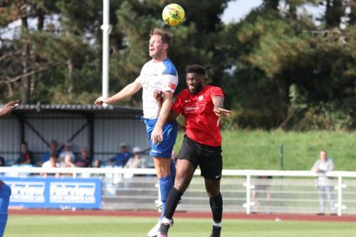 IMG 4597-Enfields-Adam-Cunnington-wins-a-header-against-Dylan-Ebengo