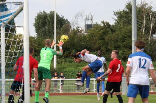 IMG 4734-Hadley-keeper-Luke-Ward-catches-a-cross-ahead-of-Sam-Youngs