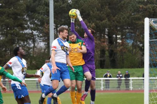 IMG 5218-Horsham-keeper-Sam-Howes-catches-a-cross-ahead-of-team-mate-Shamir-Fenelon-and-Enfields-Rian-Bray