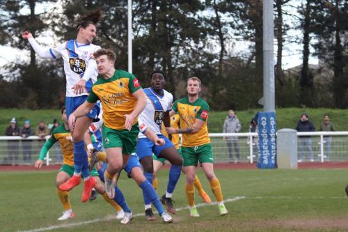 IMG 5297-Enfields-Sam-Youngs-wins-a-header-against-Charlie-Hester-Cook