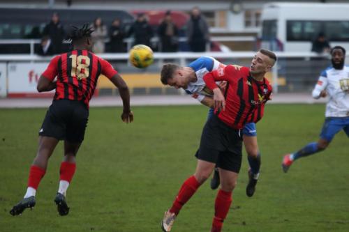 IMG 9656-Rian-Bray-wins-a-header-against-Joe-Taylor-R-and-Razz-Coleman-De-Graft