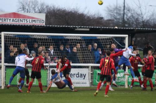 IMG 9689-Enfields-Muhammadu-Faal-challenges-keeper-Lewis-Carey-while-Adam-Cunnington-tangles-with-Lewes-captain-Mitchell-Nelson