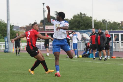 Regent's Zach Smith-Walter (L) and Enfield's Andre Coker