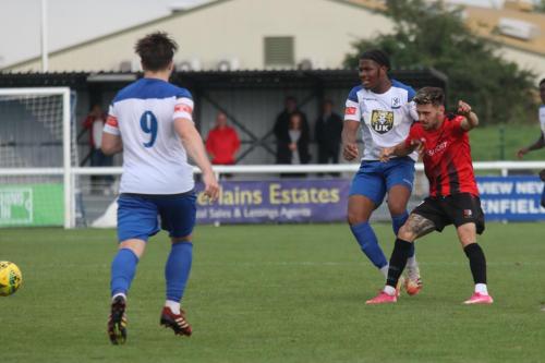 Enfield's Manny Maja (centre) and Lewis Taaffe and Regent's Max Booth