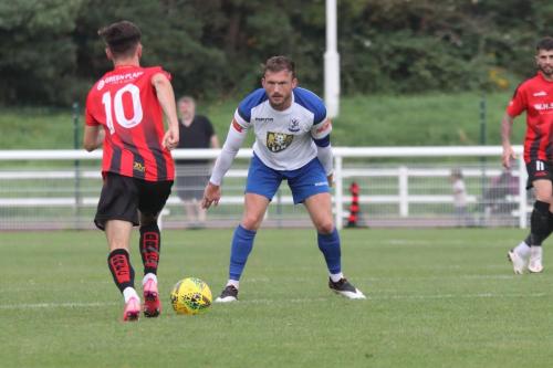 Regent's Max Booth (L) and Enfield's Scott Thomas