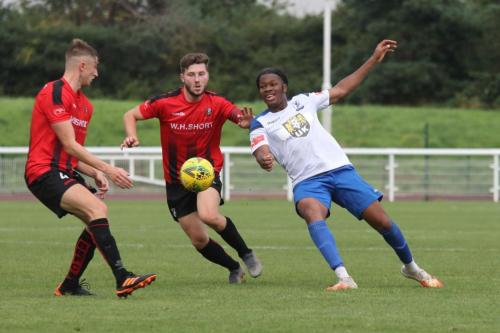 Regent's Charlie Durling (L) and Harry McDonald and Enfield's Manny Maja