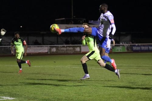 IMG 1198-Muhammadu-Faal-lifts-the-ball-over-the-onrushing-keeper-but-Bradley-Williams-behind-Faal-gets-back-to-clear