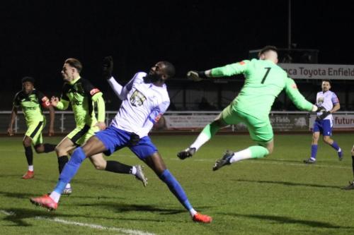 IMG 1201-Muhammadu-Faal-lifts-the-ball-over-the-onrushing-keeper-but-Bradley-Williams-behind-Faal-gets-back-to-clear