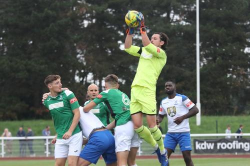 Dereham keeper Elliot Pride claims a cross