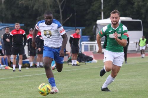 Enfield's Percy Kiangebeni (L) and Dereham's Robbie Linford