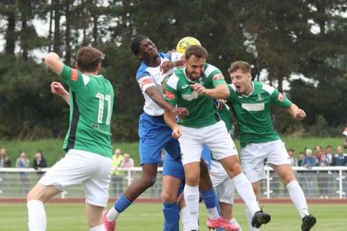 Enfield's Andre Coker challenges Robbie Linford