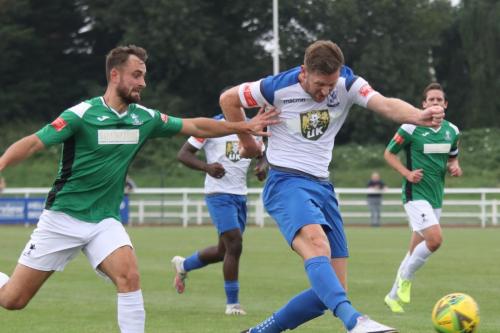 Dereham's Robbie Linford can't stop Adam Cunnington shooting