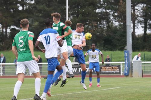 A long throw finds its way to Enfield's Andre Coker (R) who opens the scoring
