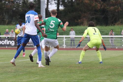 Andre Coker (far L) lines up his shot for the opening goal