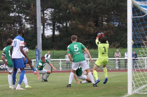 Andre Coker (pink boots) scores the first Enfield goal 