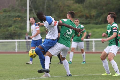 Dereham's Robbie Linford (3) challenges Muhammadu Faal