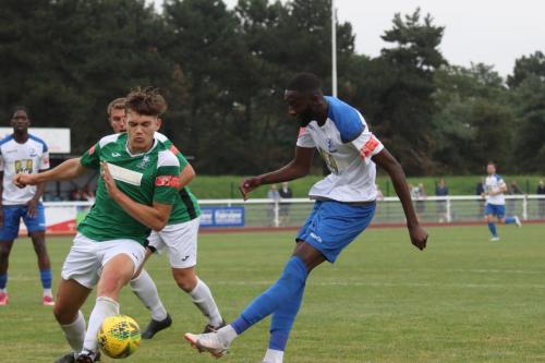 Dereham's Ashton Fox (L) blocks a shot from Muhammadu Faal