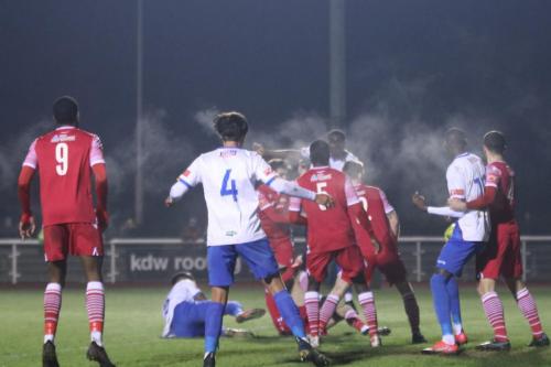 IMG 8109-Enfields-Harold-Joseph-white-shirt-L-is-wrestled-to-the-ground-to-earn-a-penalty