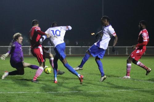 IMG 8234-Hornchurch-keeper-Joe-Wright-sets-himself-for-Nathan-Smiths-shot-which-is-blocked-by-the-knee-of-Jordan-Clark