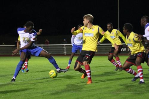 IMG 5290-Enfields-Jerry-Gyebi-L-tries-to-collect-a-loose-ball-in-the-Kingstonian-penalty-area
