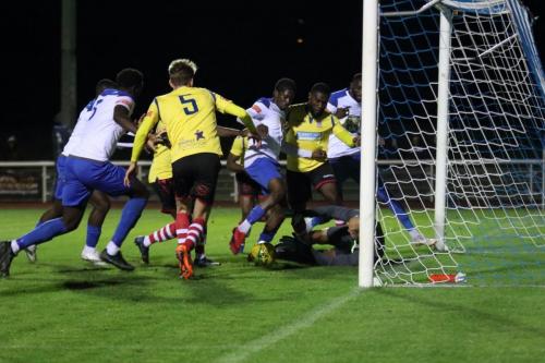 IMG 5307-Kingstonian-keeper-Rob-Tolfrey-saves-at-the-feet-of-Andre-Coker-whos-challenge-sparks-a-brief-bout-of-pushing-and-shoving