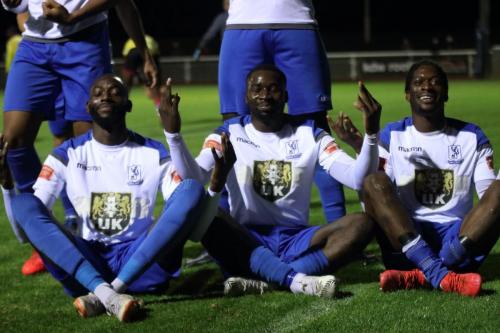 IMG 5329-Muhammadu-Faal-L-Percy-Kiangebeni-and-Andre-Coker-R-pay-homage-to-Brentfords-Yoane-Wissa