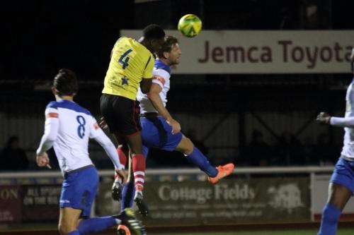 IMG 5449-Kingstonians-Jerry-Puemo-4-heads-clear-from-Adam-Cunnington