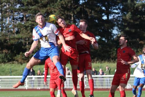 IMG 6808-Enfields-Adam-Cunnington-L-challenged-by-Alex-Fisher-3-and-Luke-Robertson