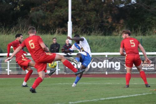 IMG 6900-Enfields-Percy-Kiangebeni-tries-to-curl-a-shot-between-David-Titov-Louis-Birch-6-and-Bernard-Tanner-5