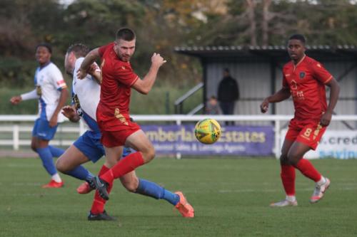 IMG 6923-Enfields-Adam-Cunnington-is-caught-in-the-face-by-the-swinging-arm-of-Louis-Birch-red